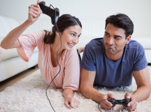 Woman beating her fiance while playing video games